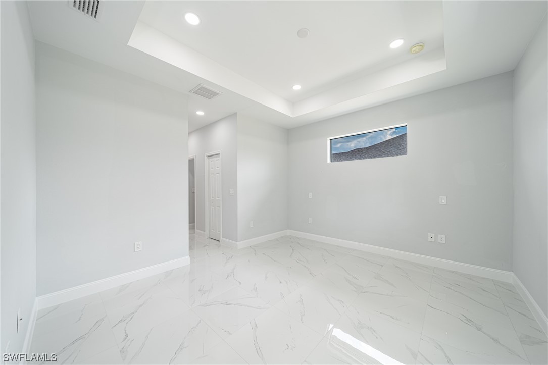 344 Rancho Avenue Lehigh Acres, FL 33974 - Photo 13 of 27 an empty room with a natural light