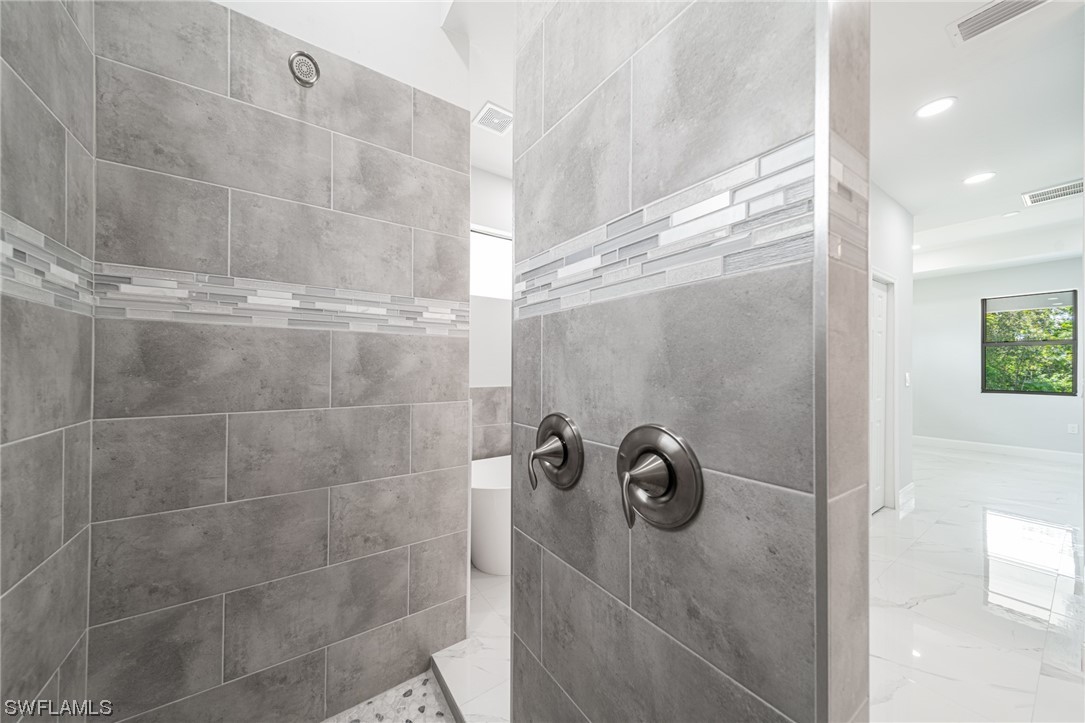 344 Rancho Avenue Lehigh Acres, FL 33974 - Photo 20 of 27 a bathroom with a shower