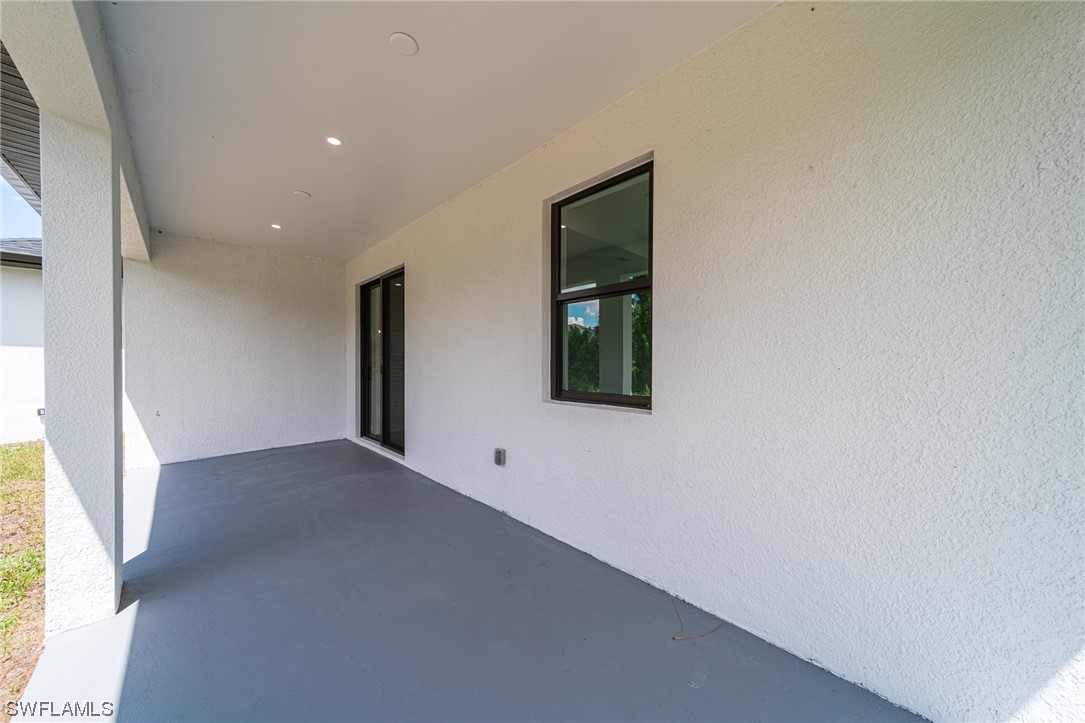 344 Rancho Avenue Lehigh Acres, FL 33974 - Photo 24 of 27 a view of an empty room with a window