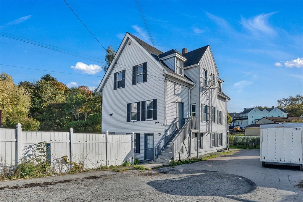 13 R Plain Street, Unit 3 Taunton, MA 02780 - Photo 14 of 19 a front view of a house with a yard