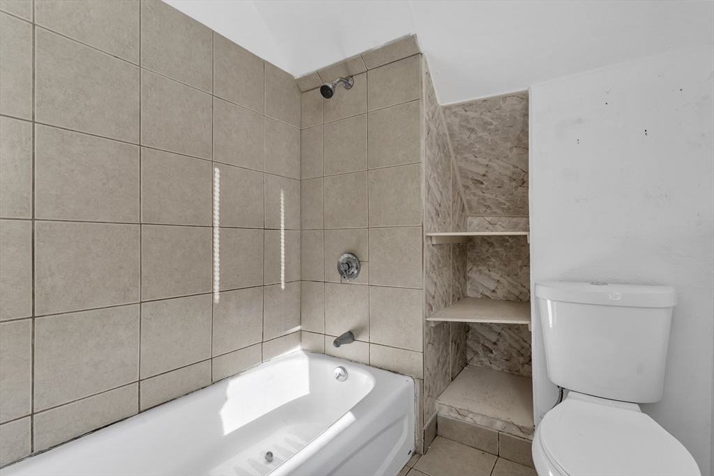 13 R Plain Street, Unit 3 Taunton, MA 02780 - Photo 17 of 19 a bathroom with a sink toilet and shower