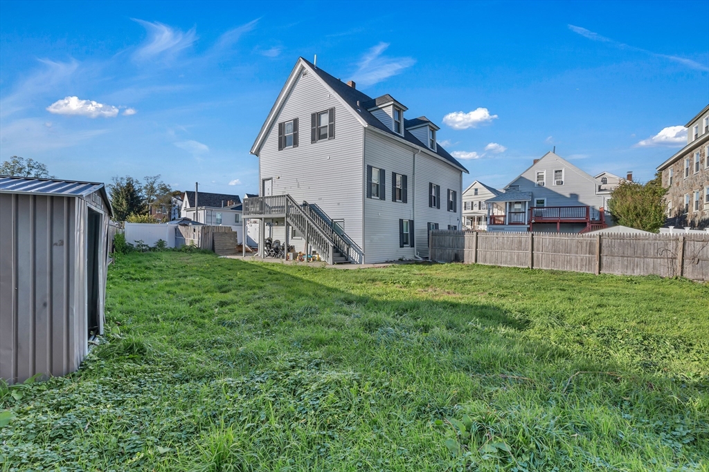 13 R Plain Street, Unit 3 Taunton, MA 02780 - Photo 18 of 19 a view of a house with a yard and sitting area