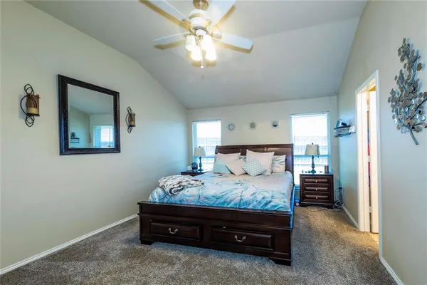 a bed room with a bed and a chandelier