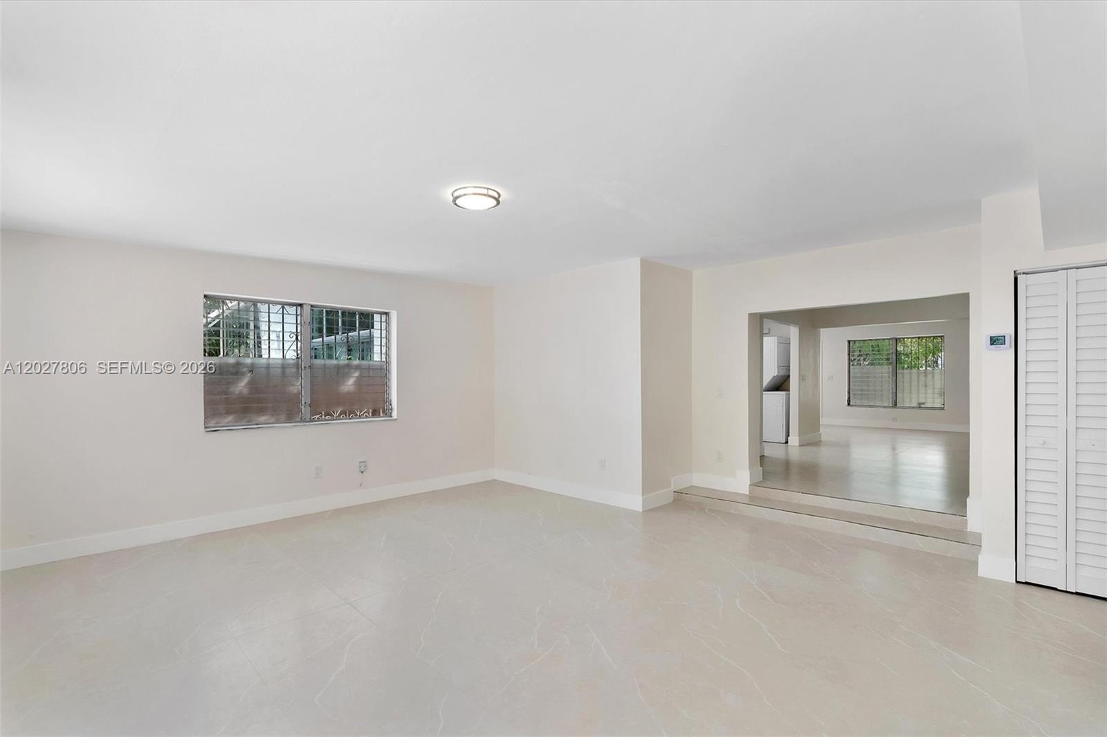 1612 Southwest 23rd Street, Unit 1612 Miami, FL 33145 - Photo 20 of 42 an empty room with a empty space and windows