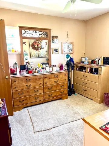 a bed room with a bed and a dresser