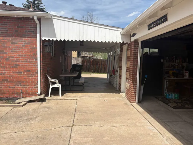 a view of a entryway with a table and chairs