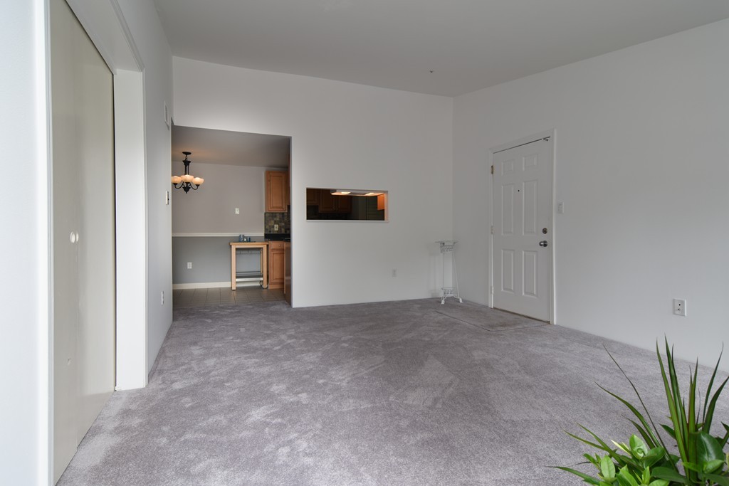 2 Walden Drive, Unit 5 Natick, MA 01760 - Photo 9 of 18 a view of a big room with closet and windows