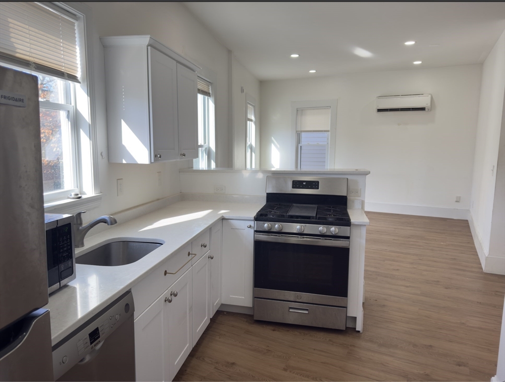 a kitchen with a stove and a sink