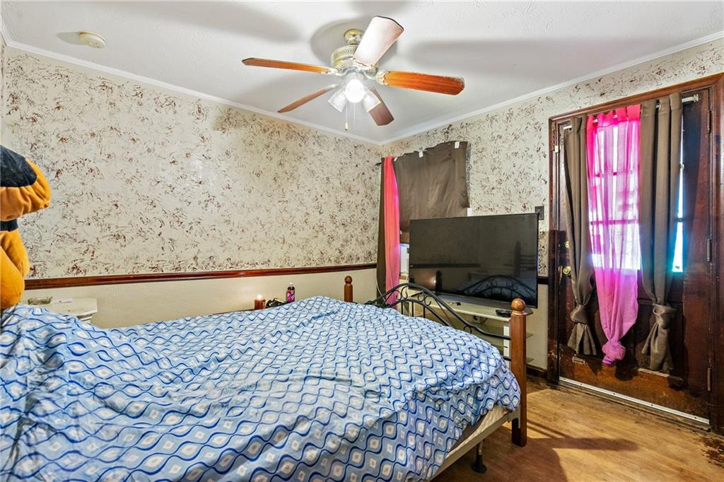 811 6th Street McKees Rocks, PA 15136 - Photo 13 of 19 a bedroom with a bed and a flat screen tv