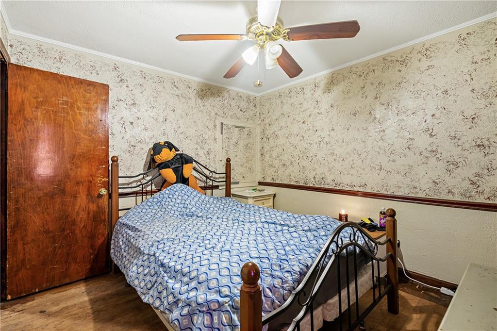 811 6th Street McKees Rocks, PA 15136 - Photo 15 of 19 a bedroom with a bed and a dresser