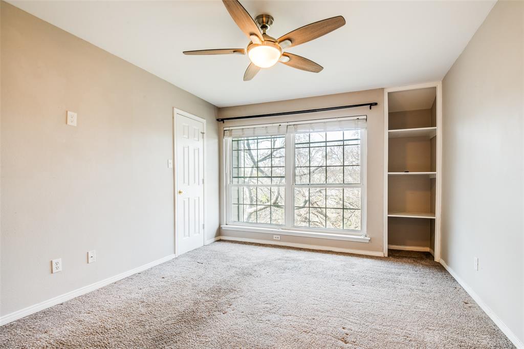 9801 Royal Lane, Unit 711 Dallas, TX 75231 - Photo 12 of 23 a view of an empty room with a window