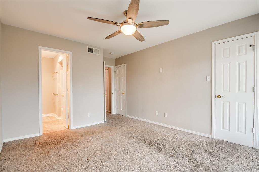 9801 Royal Lane, Unit 711 Dallas, TX 75231 - Photo 14 of 23 an empty room with closet and a ceiling fan