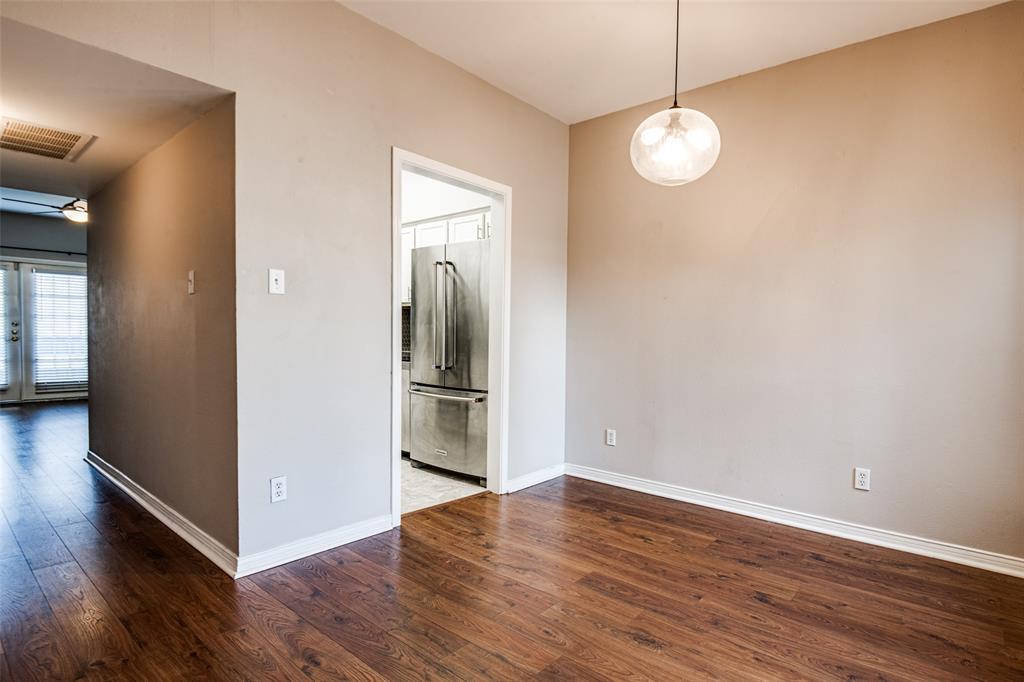 9801 Royal Lane, Unit 711 Dallas, TX 75231 - Photo 3 of 23 a view of a room with wooden floor