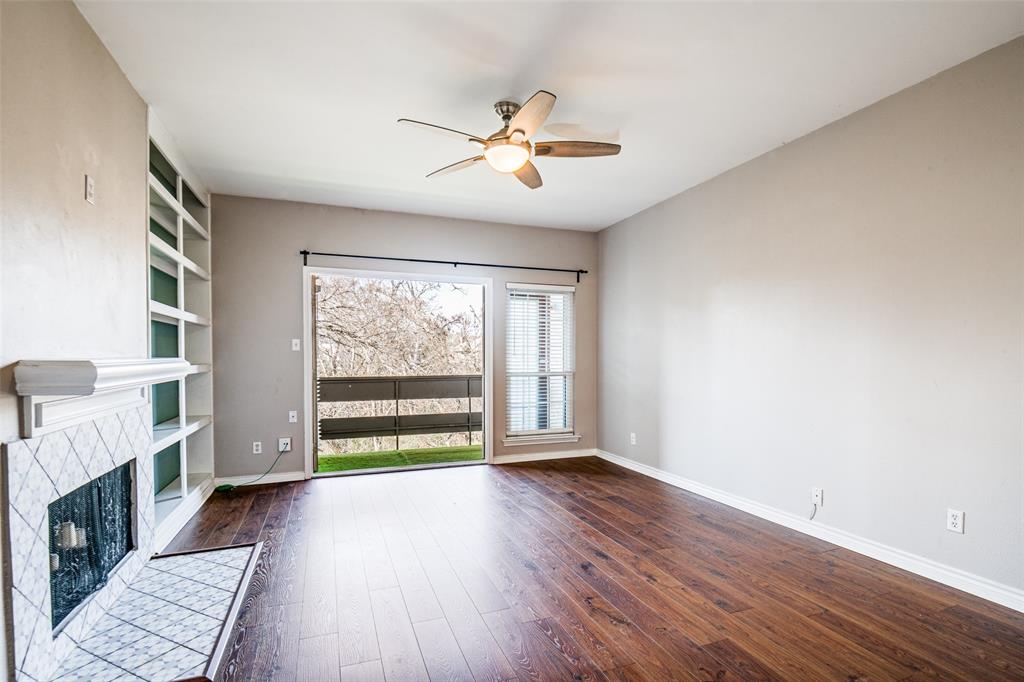 9801 Royal Lane, Unit 711 Dallas, TX 75231 - Photo 8 of 23 wooden floor in an empty room with a window