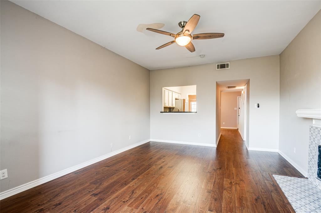 9801 Royal Lane, Unit 711 Dallas, TX 75231 - Photo 10 of 23 a view of empty room with wooden floor