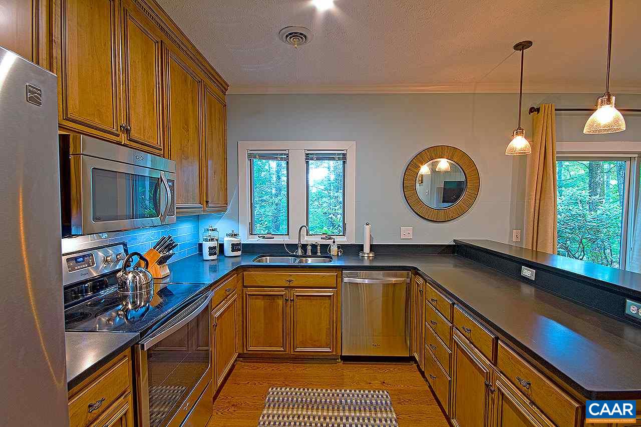 407 Three Ridges Wintergreen, VA 22967 - Photo 3 of 13 Beautiful hardwood floors in the kitchen and living room. Granite counter tops, stainless steel appliances, custom oak cabinets.
