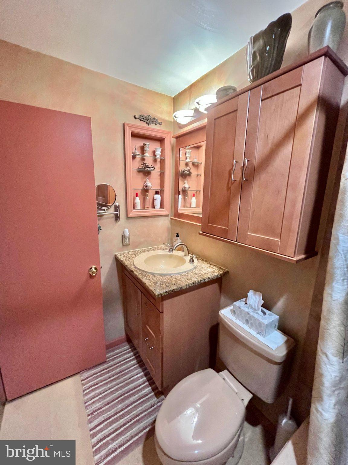 107 Carousel Circle Doylestown, PA 18901 - Photo 19 of 31 a bathroom with a granite countertop toilet sink and mirror