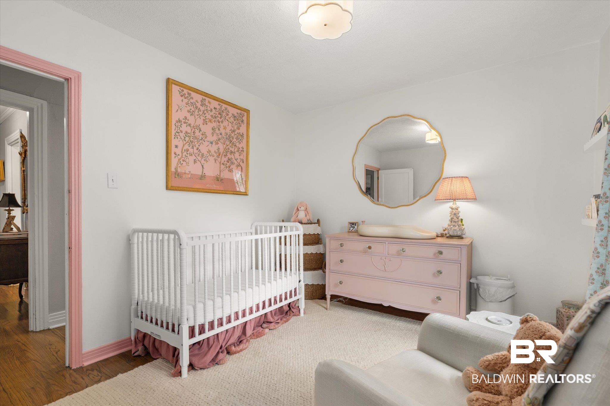 165 Crenshaw Street Mobile, AL 36606 - Photo 14 of 21 Bedroom featuring a crib and wood finished floors