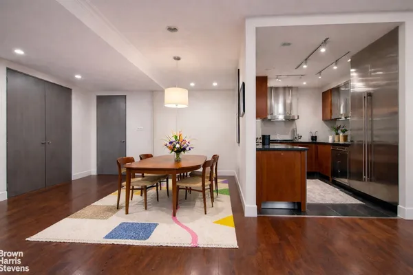 a view of a dining room with furniture and wooden floor