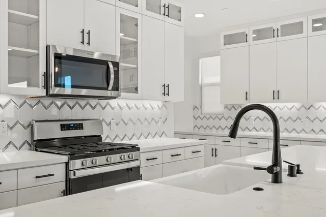 an empty room with sliding glass door and shower