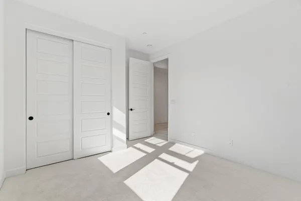 a bathroom with a double vanity sink mirror and shower