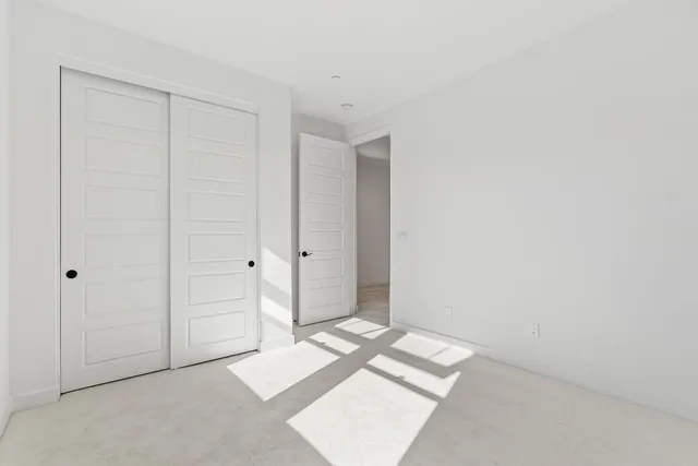 a bathroom with a double vanity sink mirror and shower