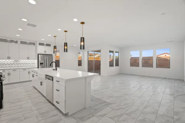 an empty room with entrance and windows