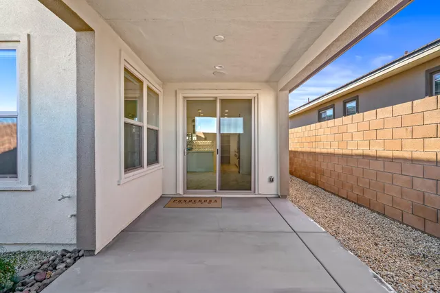 a view of a patio with a table chairs and a patio