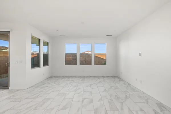a view of kitchen with counter top space and living room