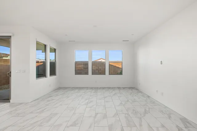 a view of kitchen with counter top space and living room