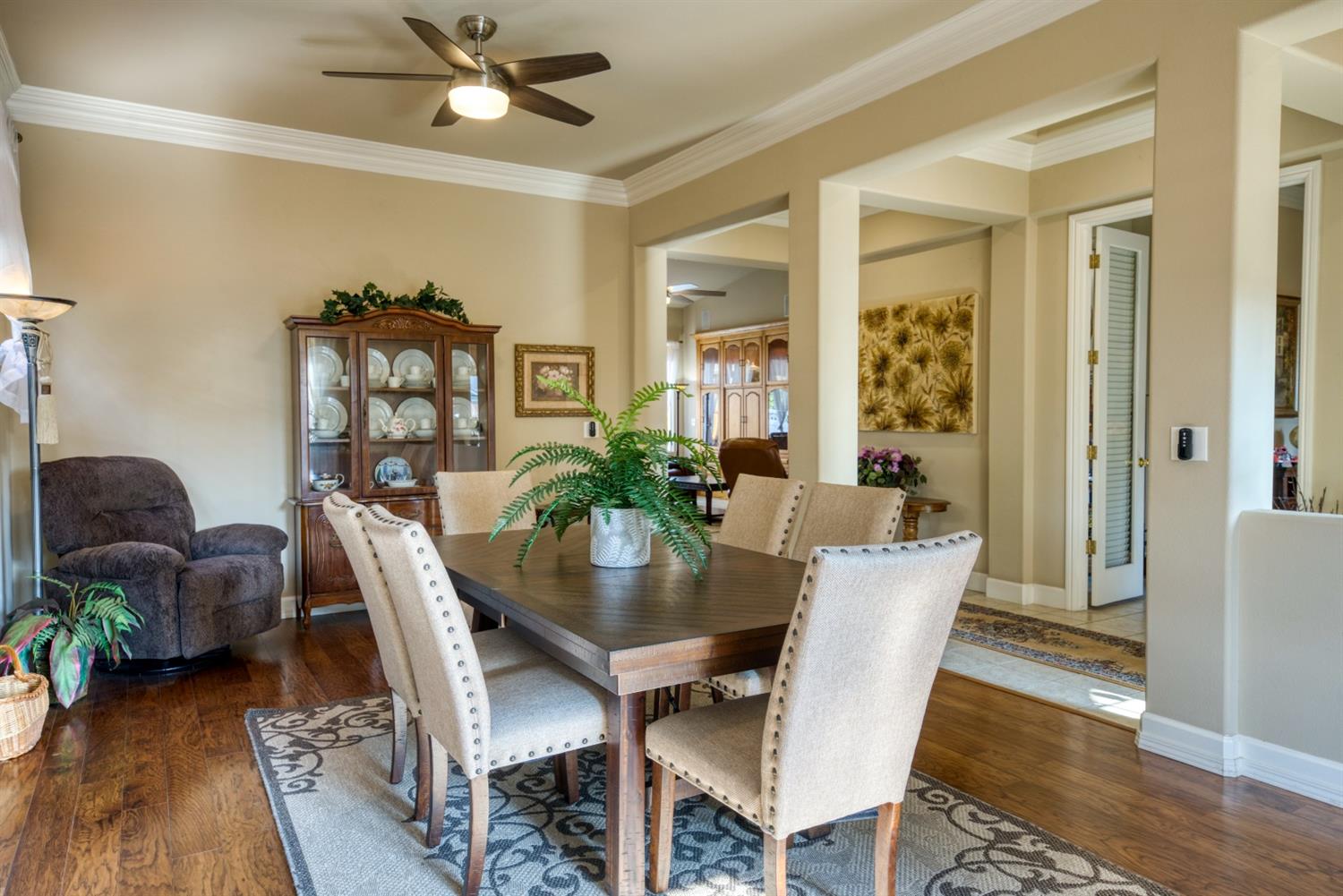 143 West Bedford Avenue Clovis, CA 93611 - Photo 11 of 55 a view of a dining room with furniture window and wooden floor