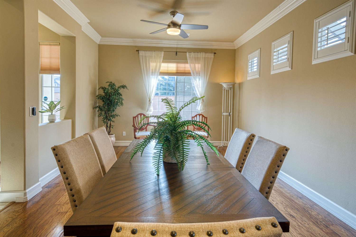 143 West Bedford Avenue Clovis, CA 93611 - Photo 13 of 55 a view of a dining room with furniture window and wooden floor