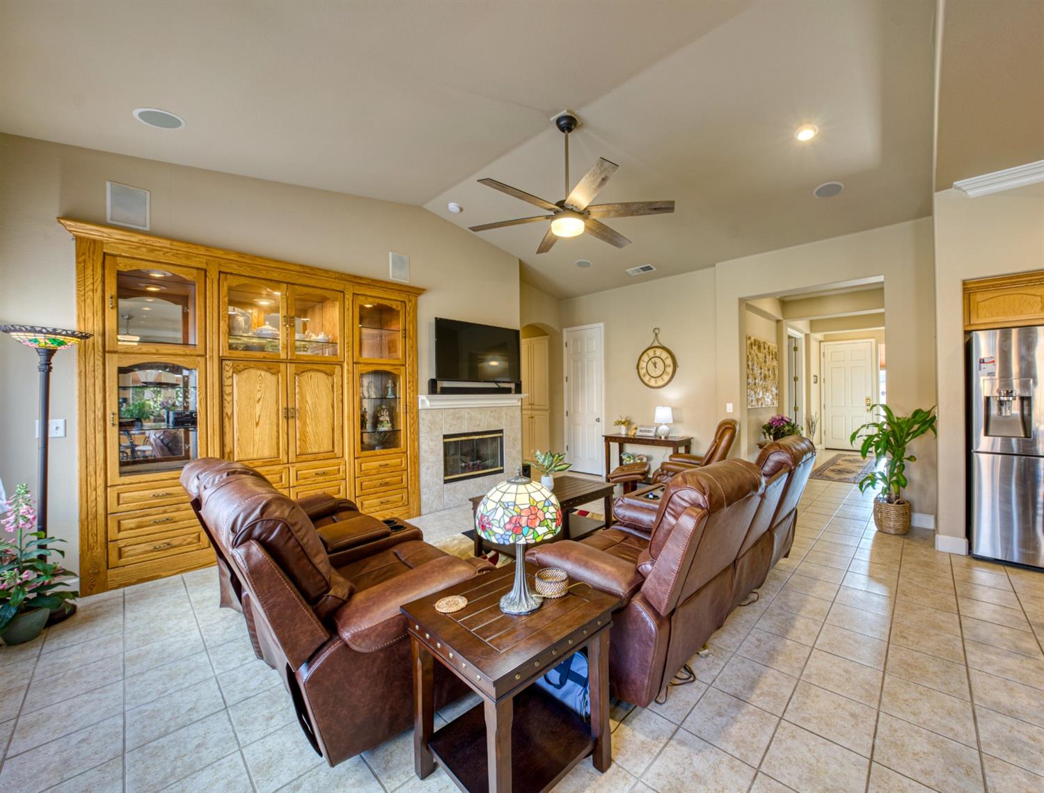 143 West Bedford Avenue Clovis, CA 93611 - Photo 16 of 55 a living room with furniture fireplace and flat screen tv