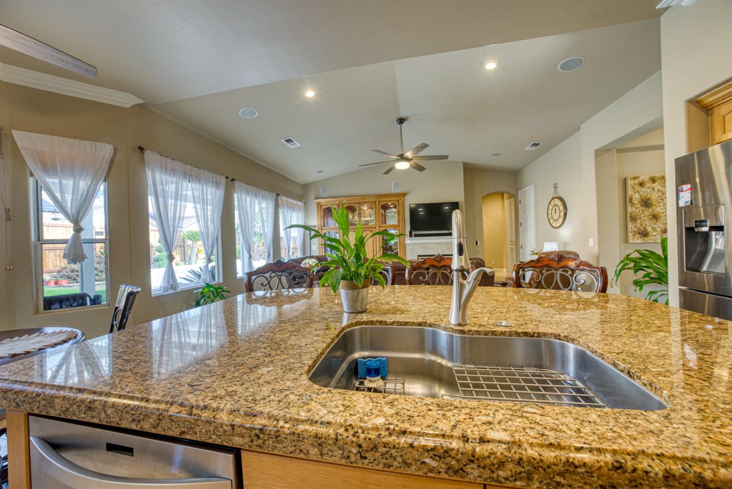 143 West Bedford Avenue Clovis, CA 93611 - Photo 23 of 55 a kitchen with granite countertop a sink and a counter top space