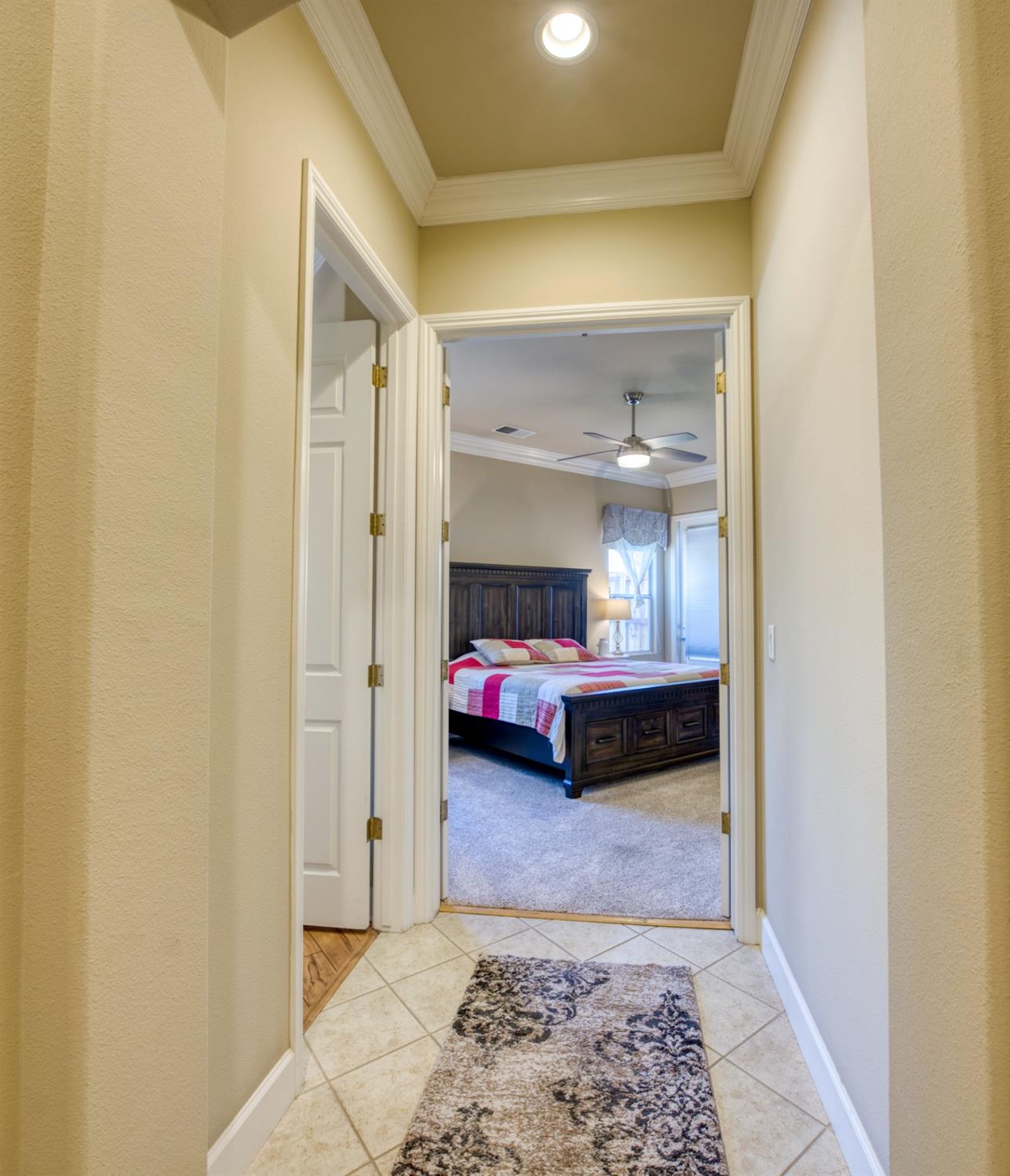 143 West Bedford Avenue Clovis, CA 93611 - Photo 26 of 55 a bedroom with a bed and a window