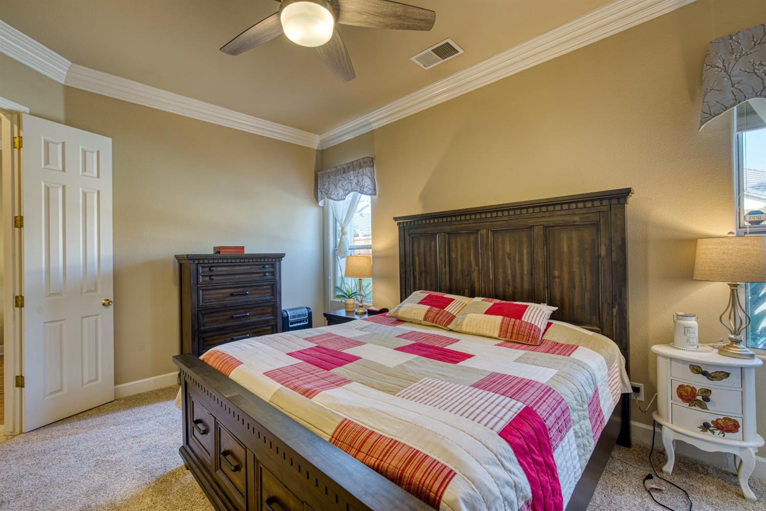 143 West Bedford Avenue Clovis, CA 93611 - Photo 29 of 55 a bedroom with a bed and a lamp