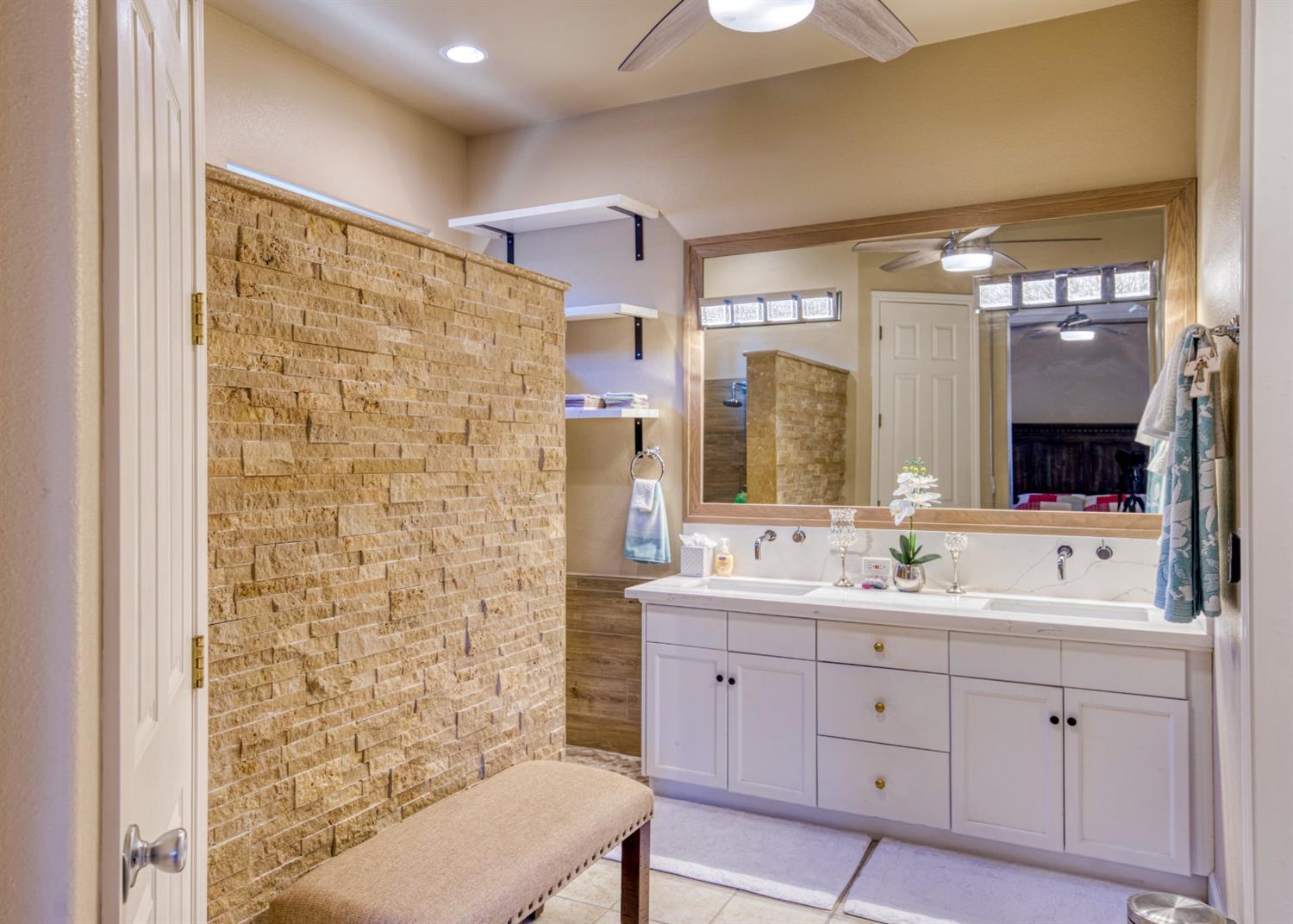 143 West Bedford Avenue Clovis, CA 93611 - Photo 30 of 55 a bathroom with a double vanity sink mirror and shower