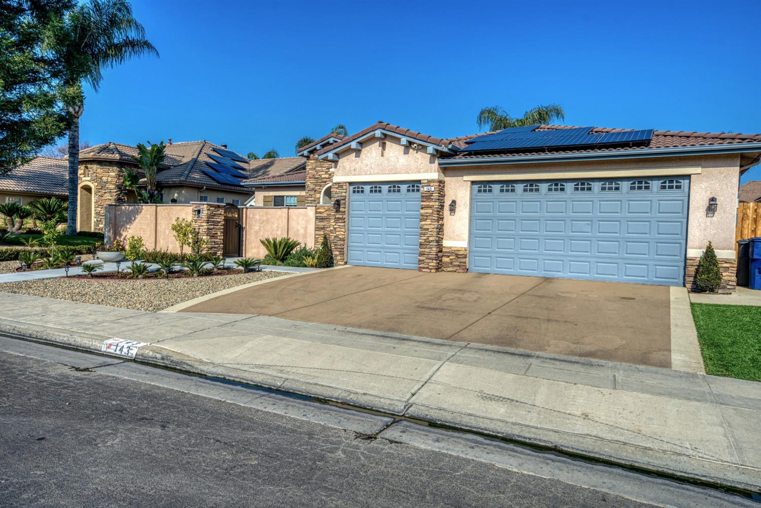 143 West Bedford Avenue Clovis, CA 93611 - Photo 3 of 55 a view of a house with a street