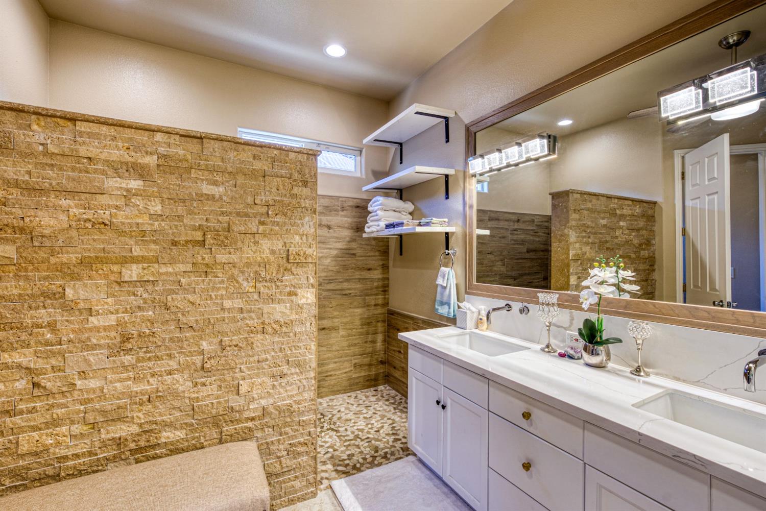 143 West Bedford Avenue Clovis, CA 93611 - Photo 31 of 55 a bathroom with a sink mirror and shower