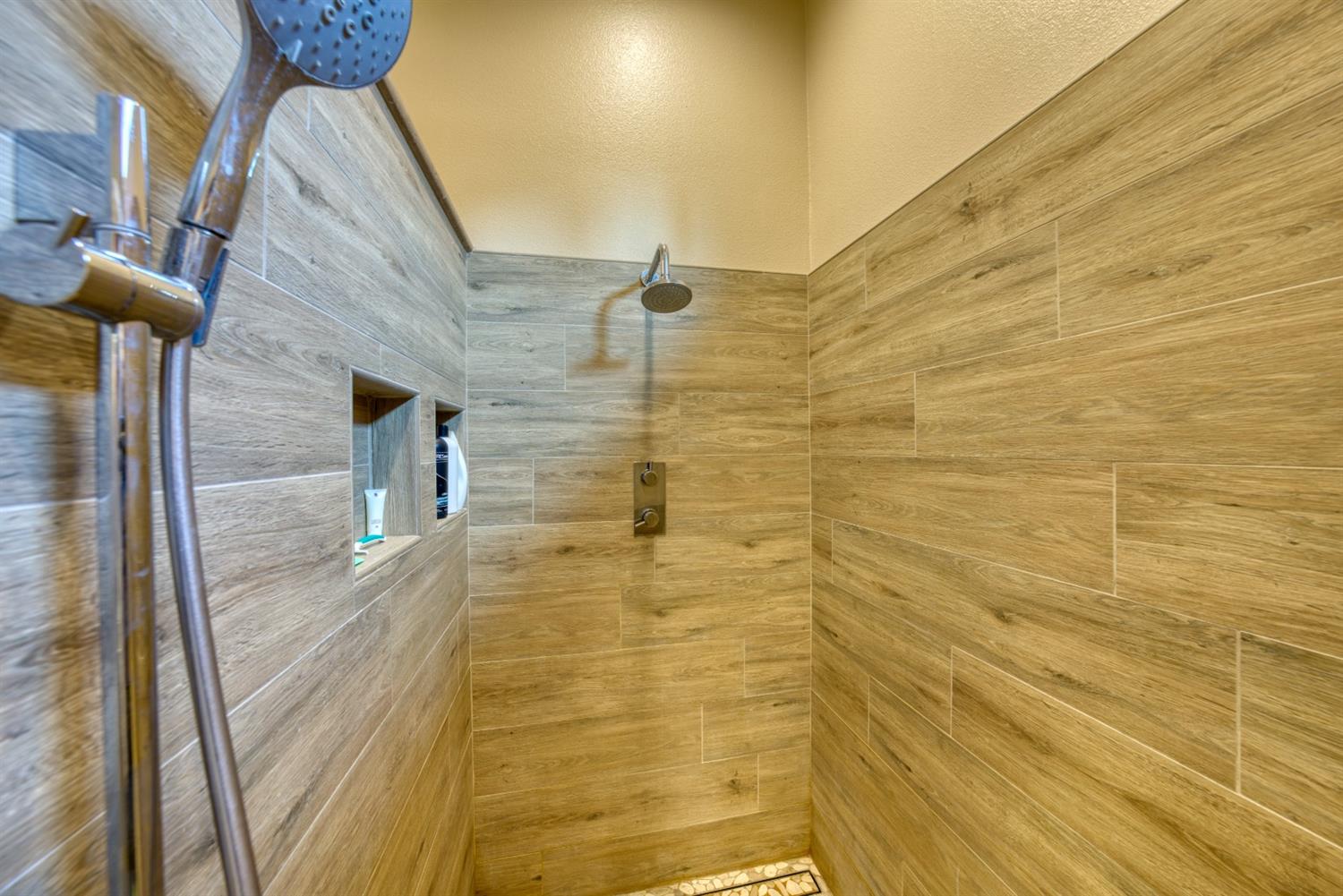 143 West Bedford Avenue Clovis, CA 93611 - Photo 32 of 55 a bathroom with a shower