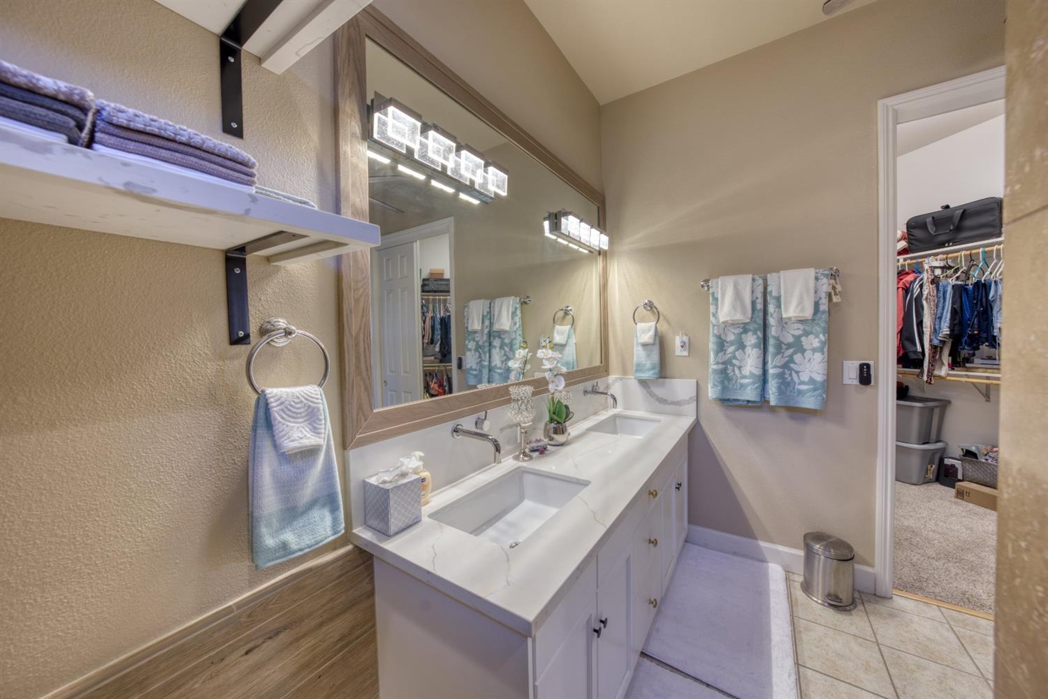 143 West Bedford Avenue Clovis, CA 93611 - Photo 33 of 55 a kitchen with stainless steel appliances granite countertop a sink and a refrigerator