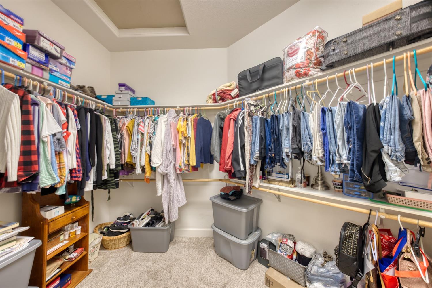143 West Bedford Avenue Clovis, CA 93611 - Photo 34 of 55 a view of walk in closet with clothes and shoes