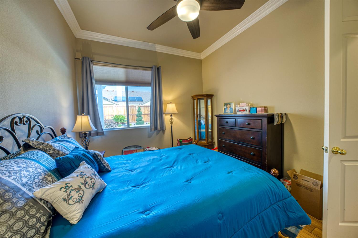 143 West Bedford Avenue Clovis, CA 93611 - Photo 37 of 55 a bed sitting in a bedroom next to a window