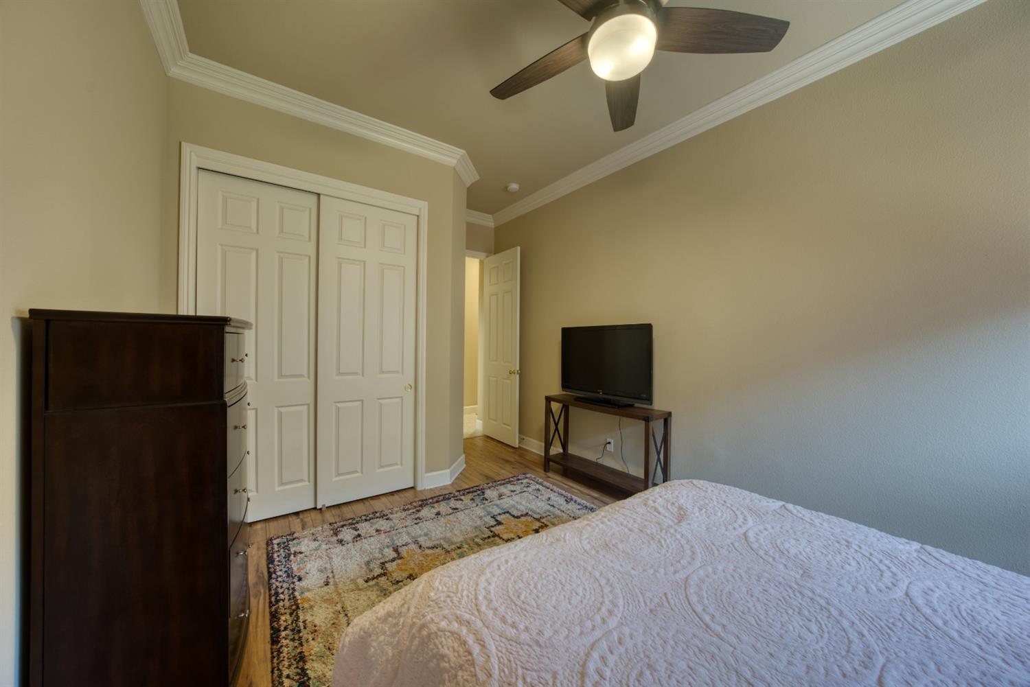 143 West Bedford Avenue Clovis, CA 93611 - Photo 40 of 55 a bedroom with a bed and a television