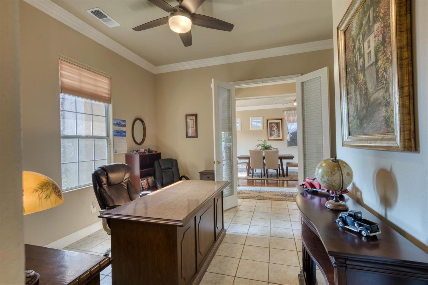 143 West Bedford Avenue Clovis, CA 93611 - Photo 42 of 55 a living room with furniture and a chandelier
