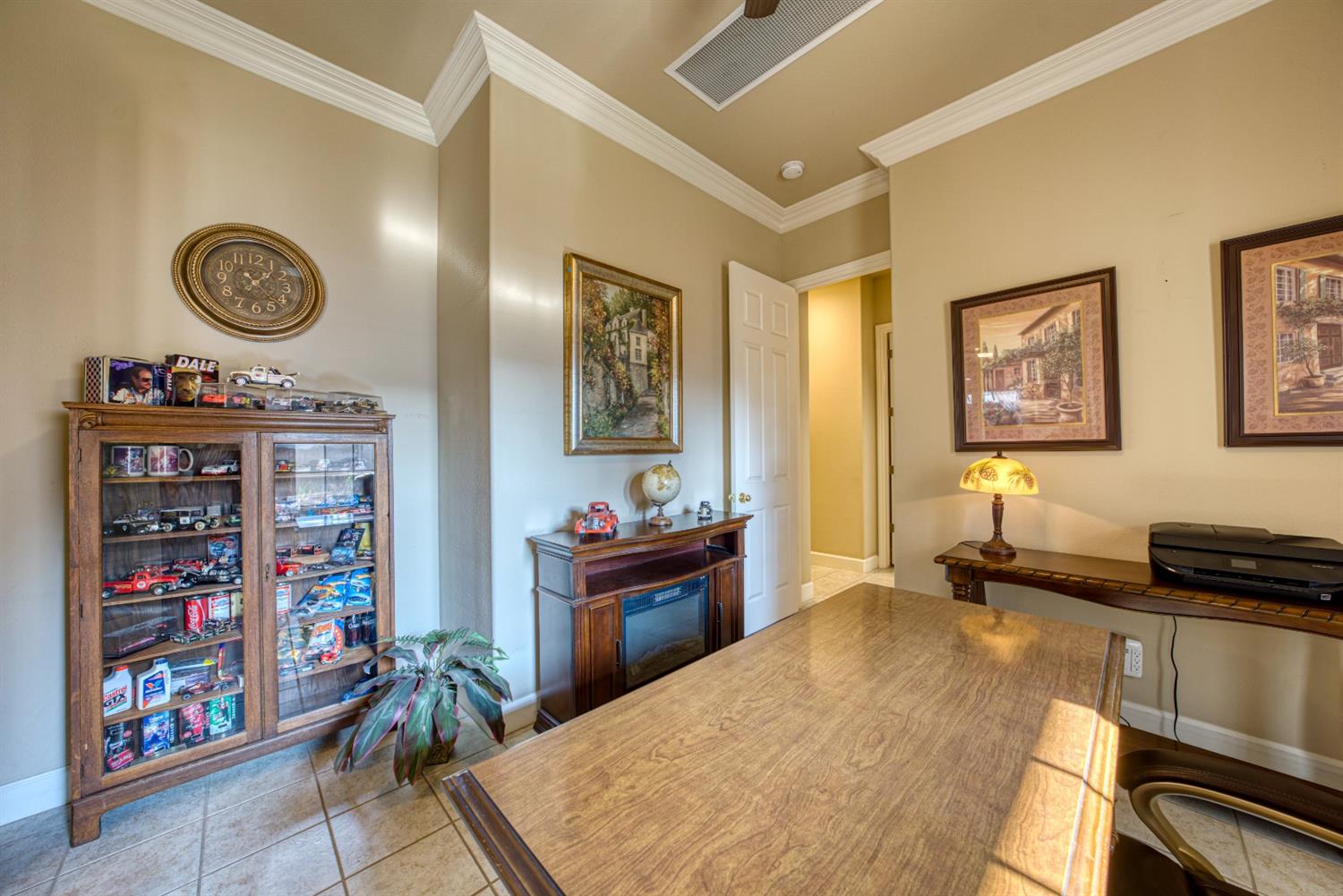 143 West Bedford Avenue Clovis, CA 93611 - Photo 44 of 55 a bed room with a bed and a television