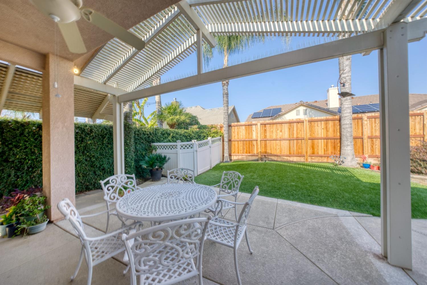 143 West Bedford Avenue Clovis, CA 93611 - Photo 54 of 55 a view of a patio with a table chairs and a backyard