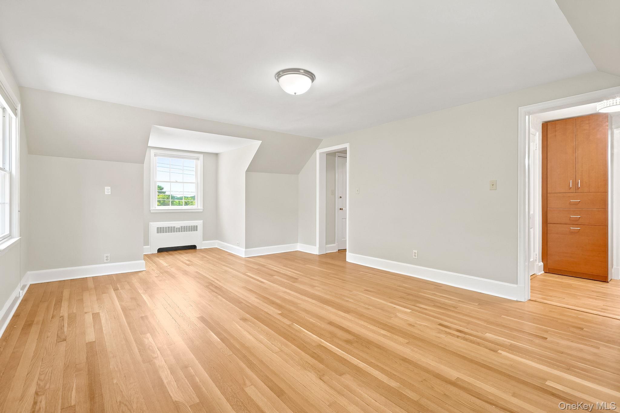 1 Sheridan Road Scarsdale, NY 10583 - Photo 21 of 40 Additional view of primary bedroom showing access to dressing area, closets and ensuite bath