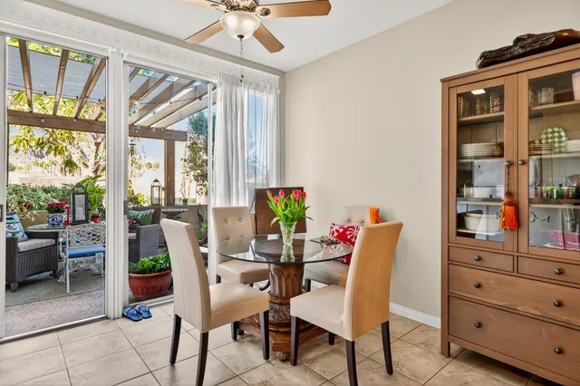 a dining room with furniture mountain view and a window