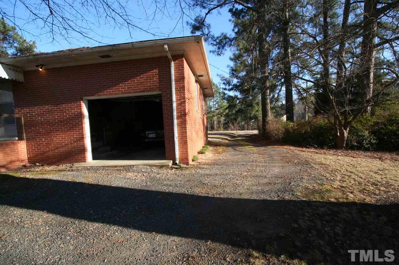 2910 Shady Grove Road Durham, NC 27703 - Photo 20 of 25 Garage is very big and has door that enters into utility area and kitchen door